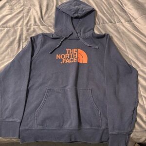 The North Face Blue Hoodie with Orange Logo